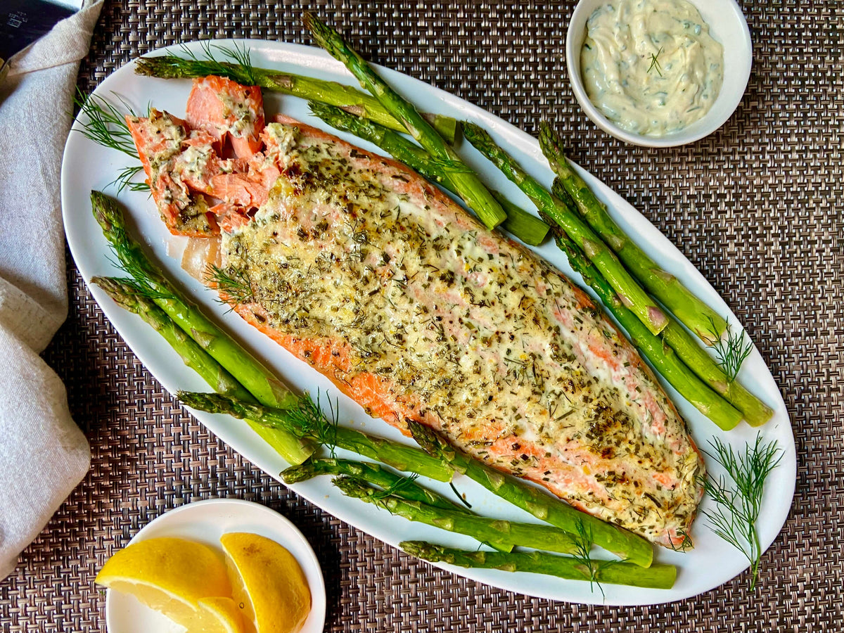 side of salmon and asparagus on a platter