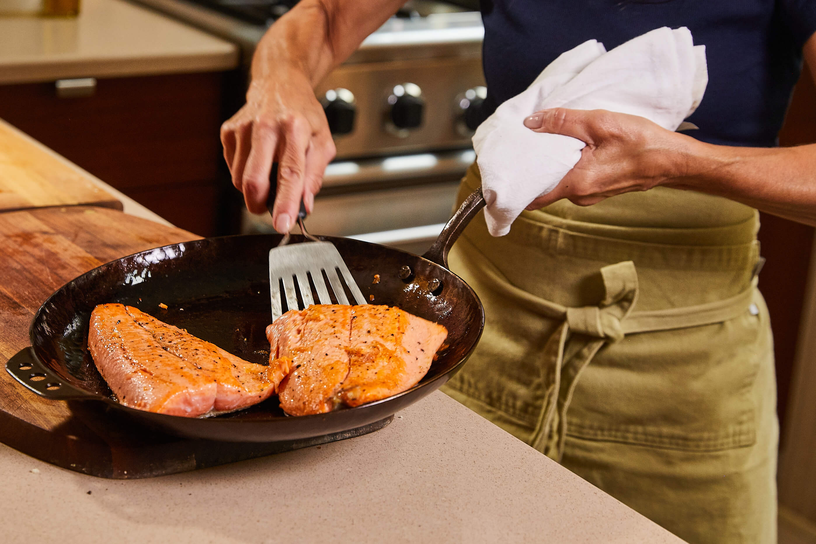 2 salmon fillets in a skillet