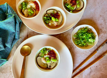 bowls on a plate with spoon and chopsticks