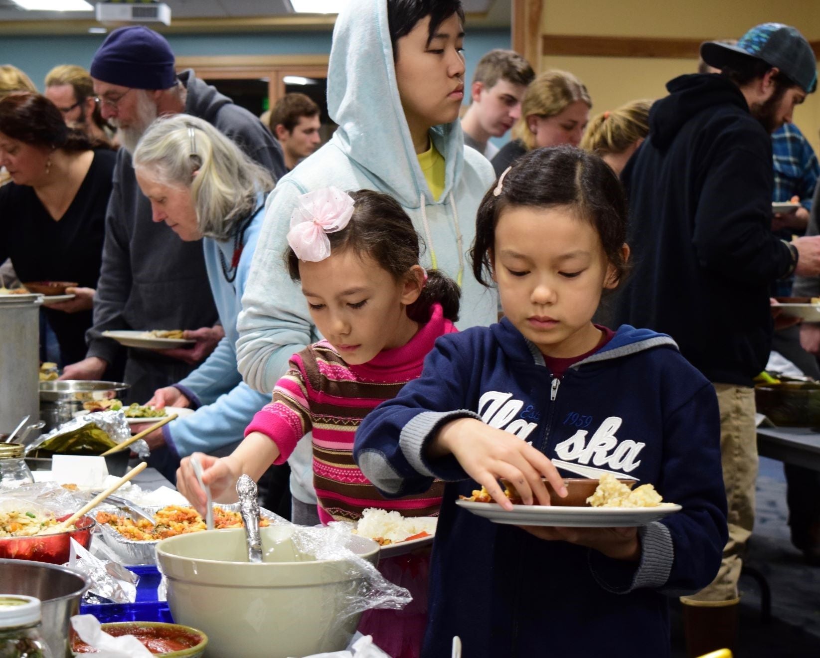 girls_filling_potluck_plates.jpg